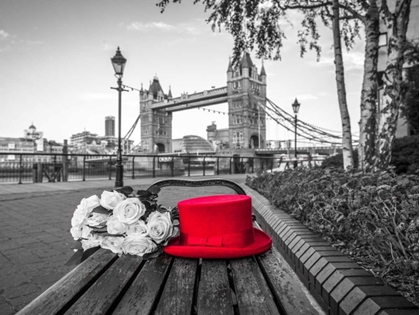 Picture of RED HAT WITH BUNCH OF ROSES ON A BENCH NEAR TOWER BRIDGE, LONDON, UK