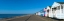 Picture of BEACH HUTS IN A ROW AGAINST BLUE SKIES