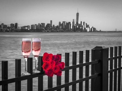 Picture of GLASSES OF CHAMPAGNE WITH BUNCH OF ROSES ON RAILING AGAINST LOWER MANHATTAN SKYLNE, NEW YORK