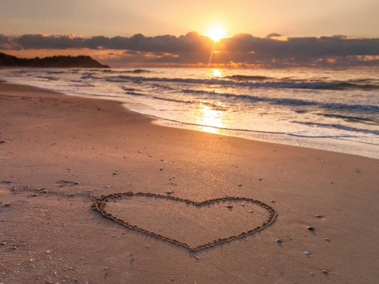 Picture of HEART SHAPE DRAWN ON SAND AT THE BEACH