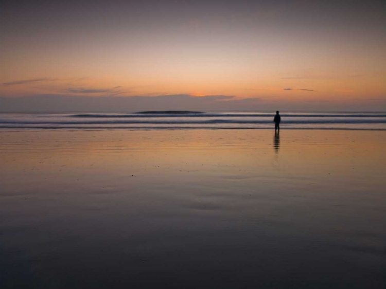 Picture of LITTLE BOY STANDING ON THE BEACH AT DUSK