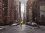 Picture of TOURIST WITH YELLOW UMBRELLA ON STREET OF MANHATTAN, NEW YORK
