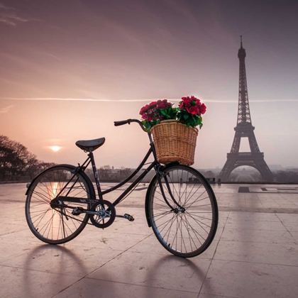 Picture of A BICYCLE WITH A BASKET OF FLOWERS WITH THE EIFFEL TOWER IN THE BACKGROUND
