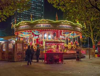 Picture of SPINNING CAROUSEL AT NIGHT IN GARDEN, LONDON, UK