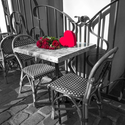 Picture of BUNCH OF ROSES ON A TABLE WITH HEART SHAPPED GIFT BOX