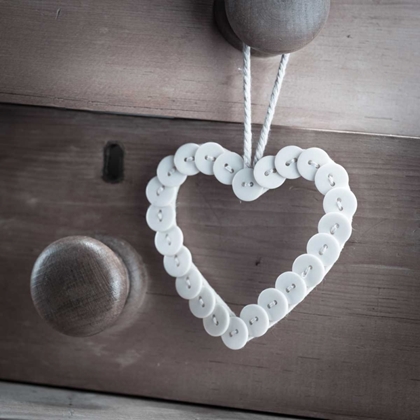 Picture of HEART MADE OF BUTTONS HUNGING ON A HANDLE