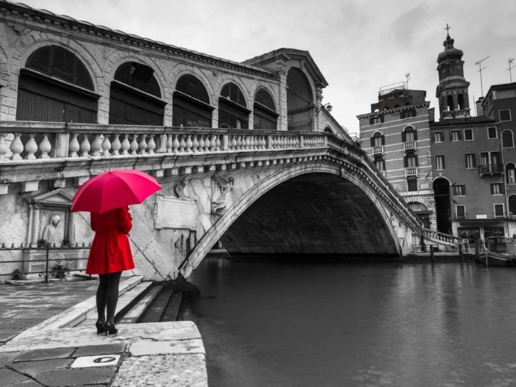 Picture of A WOMAN IN A RED DRESS HOLDING RED UMBRELLA AND STANDING NEXT TO THE RIALTO BRIDGE, VENICE, ITALY