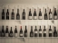 Picture of OLD WINE BOTTLES ON WOODEN SHELF