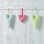 Picture of HEARTS HANGING ON WOODEN BACKGROUND