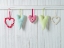 Picture of HEARTS HANGING ON WOODEN BACKGROUND