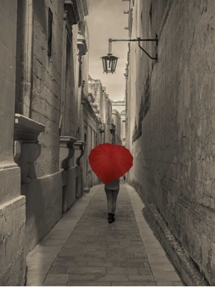 Picture of TOURIST WITH HEART SHAPED UMBRELLA WALKING THROUGH NARROW STREET OF MDINA, MALTA
