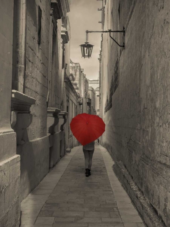 Picture of TOURIST WITH HEART SHAPED UMBRELLA WALKING THROUGH NARROW STREET OF MDINA, MALTA
