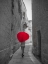 Picture of TOURIST WITH HEART SHAPED UMBRELLA WALKING THROUGH NARROW STREET OF MDINA, MALTA
