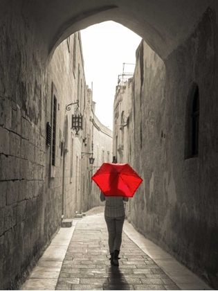 Picture of TOURIST WITH UMBRELLA WALKING THROUGH NARROW STREET IN MDINA, MALTA