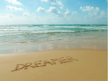 Picture of WORD DREAMER WRITTEN IN SAND ON THE BEACH