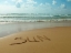 Picture of WORD SUN WRITTEN IN SAND ON THE BEACH