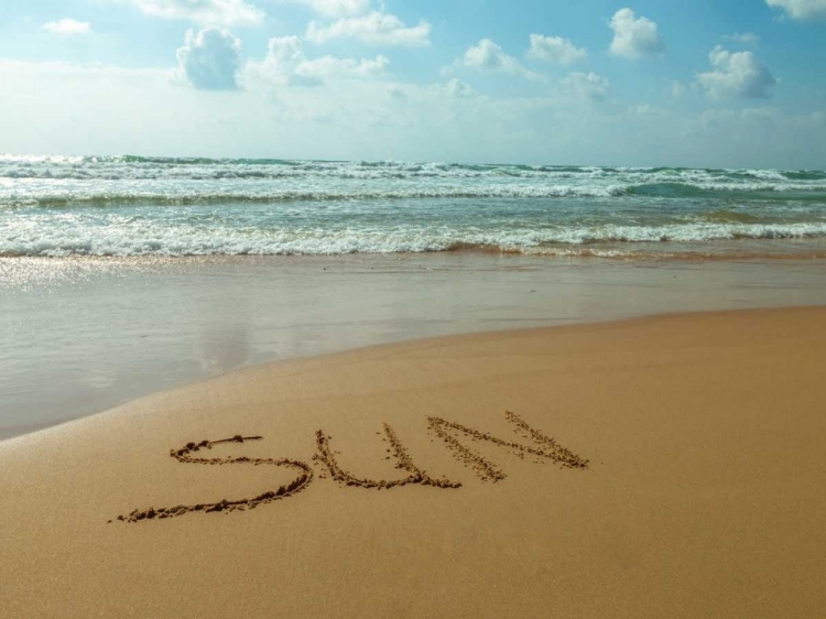 Picture of WORD SUN WRITTEN IN SAND ON THE BEACH