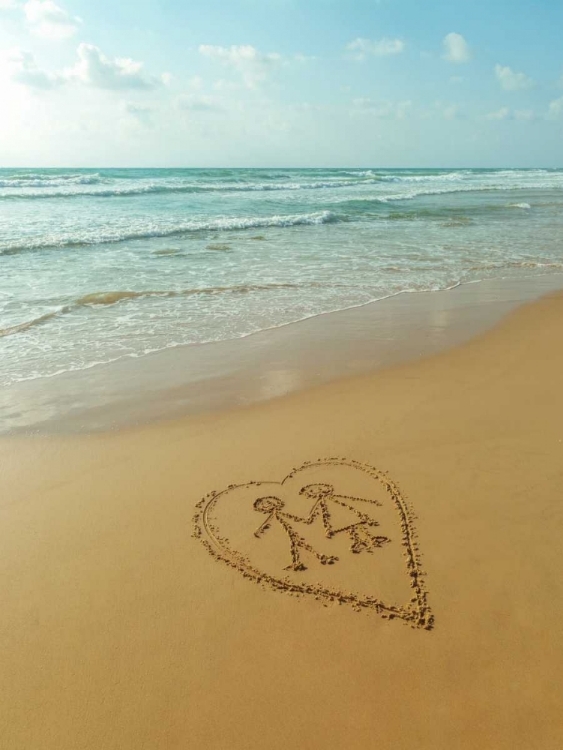 Picture of COUPLE IN HEART DRAWN ON SAND AT THE BEACH