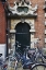 Picture of NETHERLANDS, AMSTERDAM BICYCLES BY BUILDING DOOR