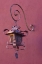 Picture of MEXICO COPPER LAMP HUNG FROM PINK-PURPLE WALL