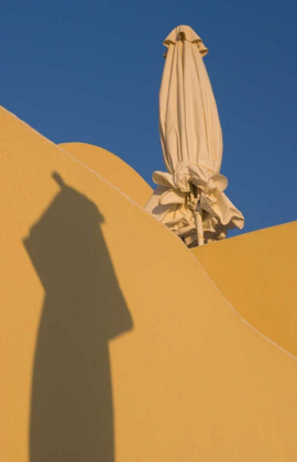 Picture of GREECE, SANTORINI SUN UMBRELLA AGAINST A WALL