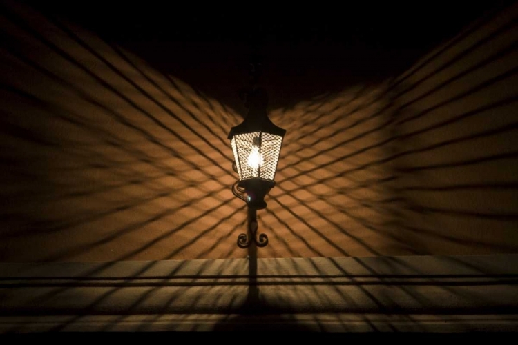 Picture of MEXICO WIRE CAGE LAMP AT NIGHT CREATES SHADOWS