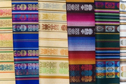 Picture of ECUADOR, QUITO SHAWLS DISPLAYED AT MARKET