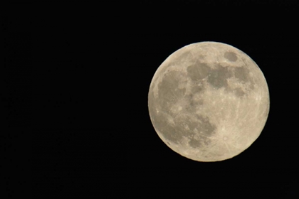 Picture of FULL MOON WITH YELLOWISH HUE TO RIGHT OF FRAME
