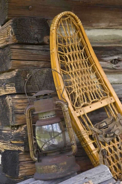 Picture of MT, A LANTERN AND SNOWSHOE OUTSIDE A LOG CABIN