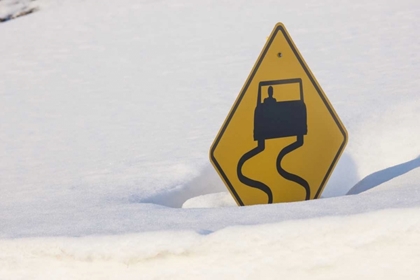 Picture of COLORADO A SLIPPERY WHEN WET SIGN BURIED IN SNOW
