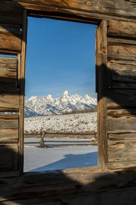 Picture of WY, GRAND TETONS MOUNTAINS THROUGH CABIN DOORWAY