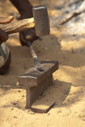 Picture of NAMIBIA, CAPRIVI STRIP BUSHMAN MAKES A SPEAR