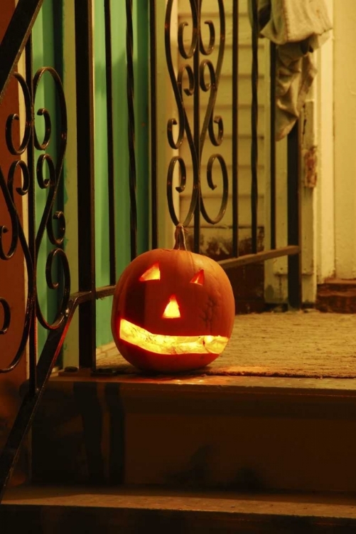 Picture of OR, PORTLAND LIGHTED JACK-O-LANTERN ON PORCH