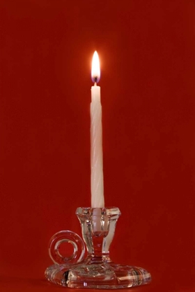 Picture of BURNING CANDLE IN A GLASS CANDLE HOLDER