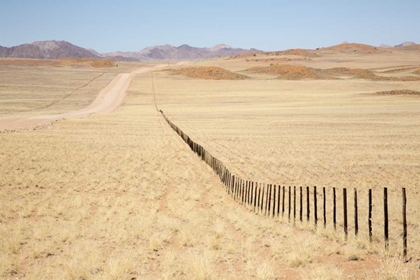 Picture of NAMIBIA, NAMIB DESERT ROAD AND FENCE IN DESERT