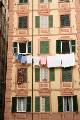 Picture of ITALY, CAMOGLI LAUNDRY HANGS ACROSS A BUILDING