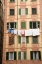 Picture of ITALY, CAMOGLI LAUNDRY HANGS ACROSS A BUILDING