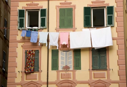 Picture of ITALY, CAMOGLI LAUNDRY HANGS ACROSS A BUILDING