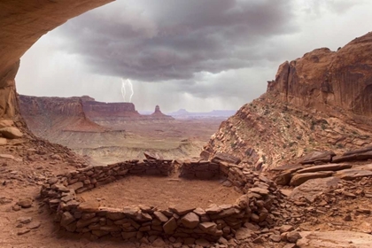 Picture of UT, CANYONLANDS NP ANASAZI RUIN WITH LIGHTNING
