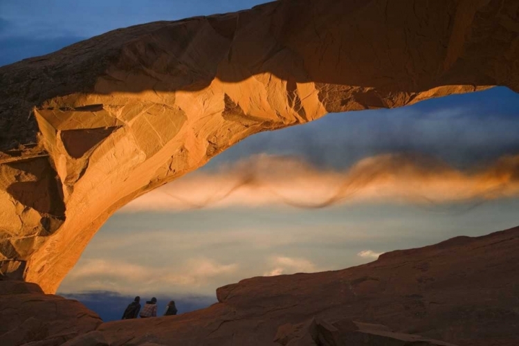 Picture of UT, ARCHES NP HIKERS AT SKYLINE ARCH AT SUNSET