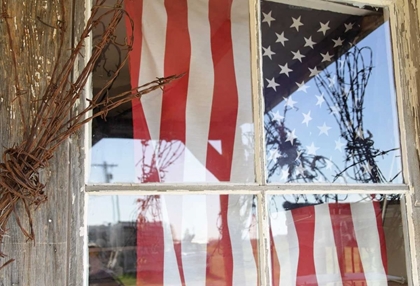 Picture of OR, SHANIKO FLAG IN WINDOW NEXT TO BARBED WIRE