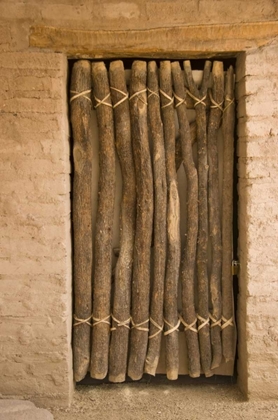 Picture of AZ, TUCSON DOOR MADE OF POLES IN AN ADOBE WALL