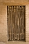 Picture of AZ, TUCSON DOOR MADE OF POLES IN AN ADOBE WALL