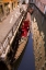 Picture of ITALY, VENICE GONDOLA PARKED IN A CANAL