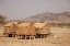 Picture of NAMIBIA, OPUWO STORAGE HUTS IN A HIMBA VILLAGE