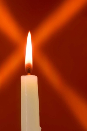 Picture of BURNING CANDLE WITH STAR BURST ON RED BACKGROUND