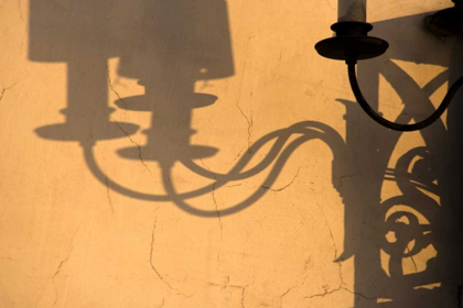 Picture of ITALY, VENICE LAMP AND SHADOWS ON A YELLOW WALL