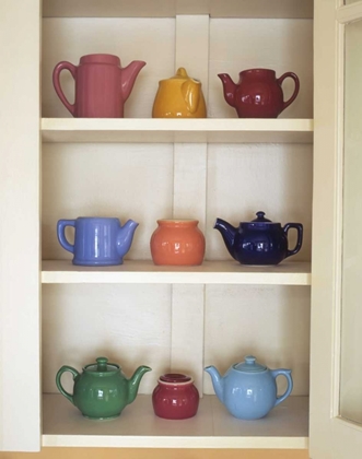 Picture of ANTIQUE CERAMIC TEAPOTS AND SUGAR BOWLS IN CUPBOARD