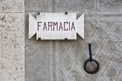 Picture of ITALY, TUSCANY, PIENZA PHARMACY SIGN ON WALL