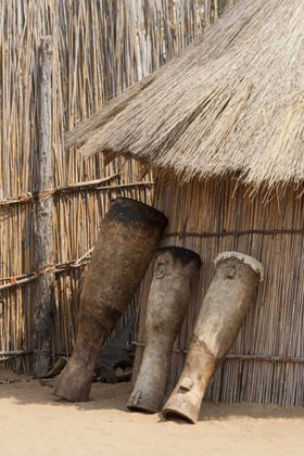 Picture of NAMIBIA, CAPRIVI STRIP TRIBAL DRUMS LEAN ON HUT